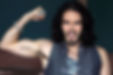 Russell Brand showing his Krishna tattoo
