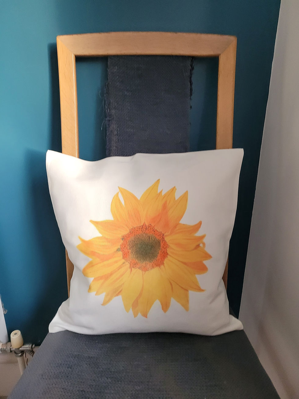Thumbnail: A sunflower cushion with insert. Sunflower design against the white fabric background.