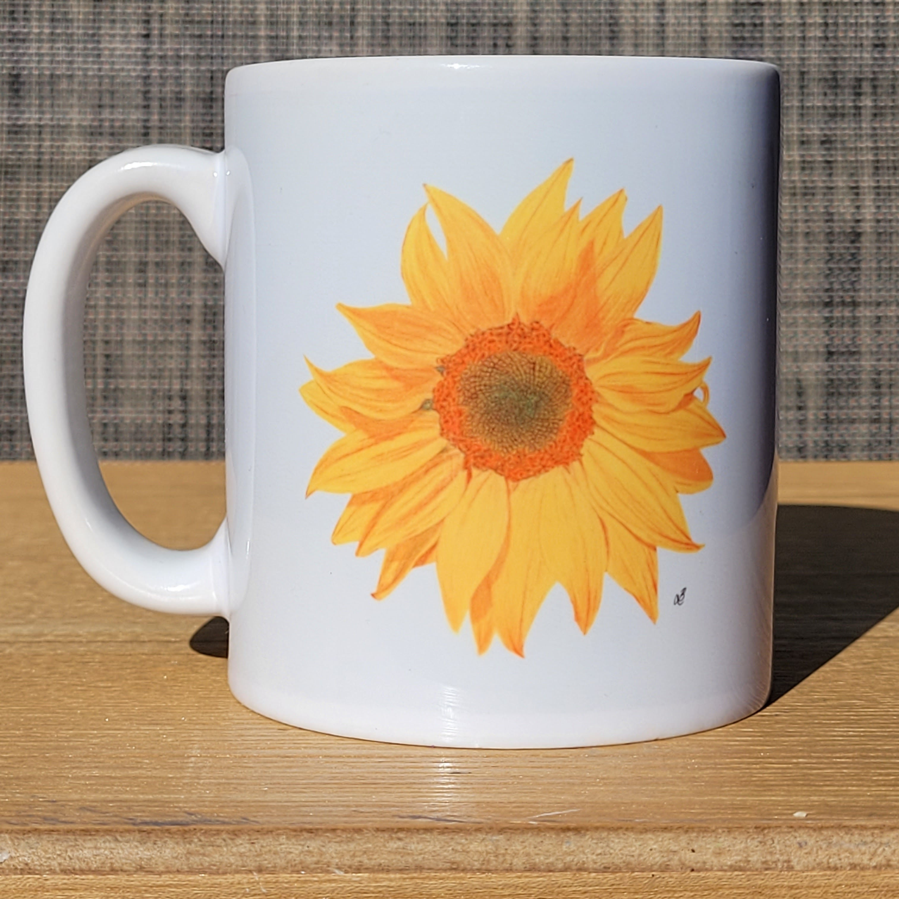 Sunflower mug. A bright yellow sunflower on a white background. First side of double sided design.