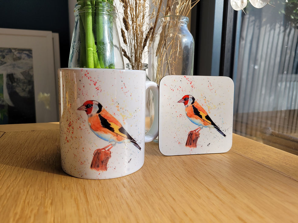 Thumbnail: A goldfinch mug and matching coaster. Watercolour goldfinch on a white background.