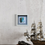 Thumbnail: Contours of Blue II. A mixed media / collage mini by Louise Brook.  Interior sideboard / hallway setting.