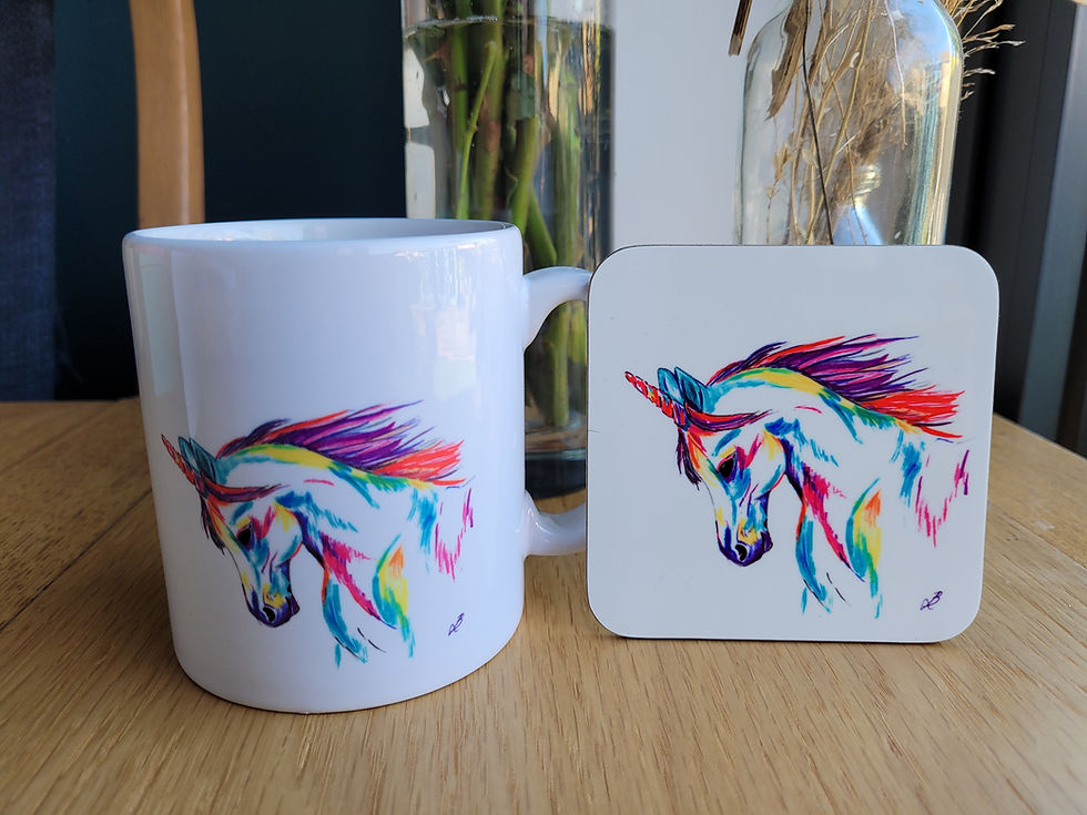 Thumbnail: Close up of a unicorn mug and matching coaster. A rainbow unicorn on a white background.