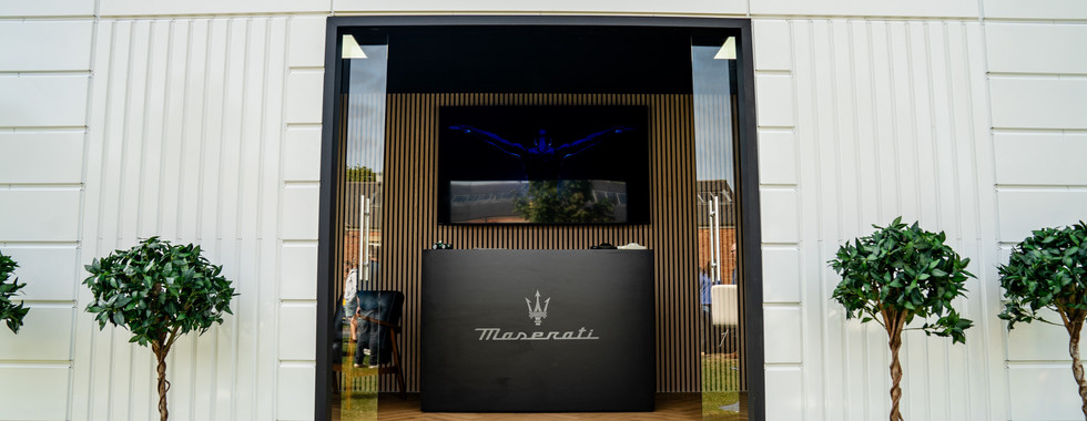 Premium event lounge hire unit branded for Maserati at Bicester Heritage Scramble April 2026