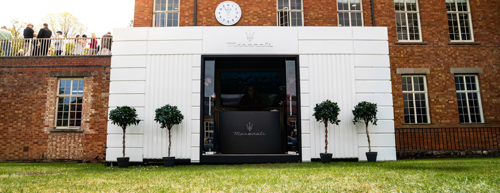 Premium event lounge hire unit branded for Maserati at Bicester Heritage Scramble April 2026