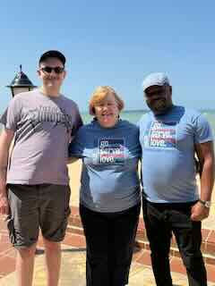 Ben stands with Kulea Villages leaders Deborah and Paul Magaya during his summer in Tanzania. 
