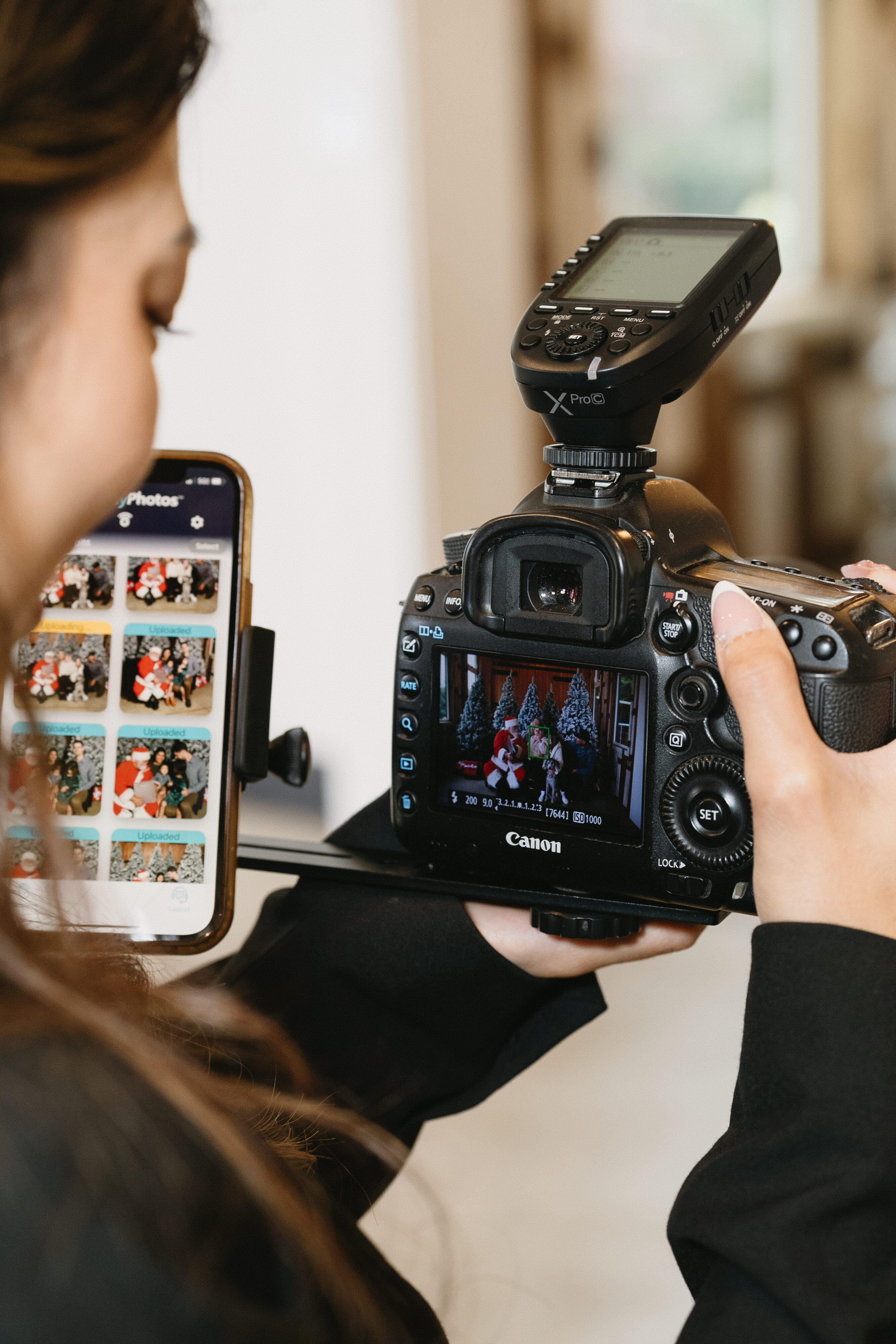Guest receiving event photos on her phone through facial recognition delivery