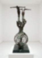 “Bronze sculpture ‘The Sammy Lee Diving Award’ by Robert Kranz (1991), showing a hollow globe on a green marble base with patinated continents, a wave of water, and two nude divers emerging from outstretched hands.”