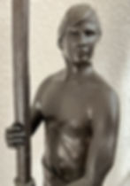 “Bronze sculpture ‘The Oarsman’ by Victor Fisher (2001), classical figure in shorts and sandals standing with both hands on a paddle, mounted on a 9‑inch round black marble base, 27 inches tall to top of oar.”