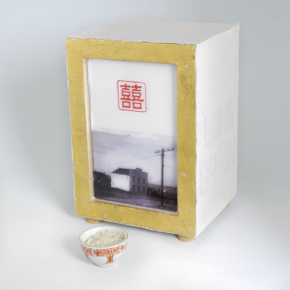 Photograph of a gilded box with a photo transfer, bowl of rice, and Chinese characters.