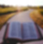 opened book on brown field during daytime_edited.jpg