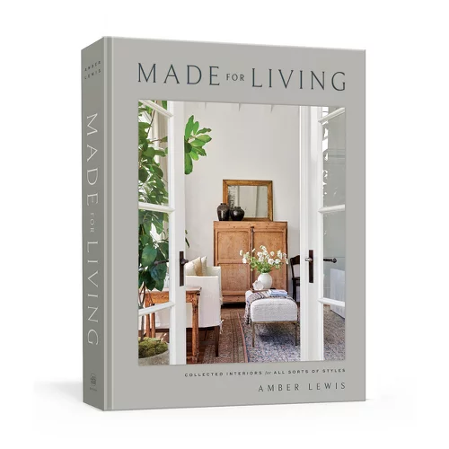 "Made for Living" book by Amber Lewis showing a minimalist room with green plants, neutral tones, and cozy decor. Text details on cover.
