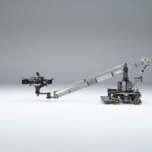 Designed to carry 1 or 2 persons plus camera, the DUO JIB is a stable, modular jib ideal for working on tight sets. Mounted on the MAGNUM DOLLY, it provides a huge lift range and with the rotatable bearing of the dolly a  smooth 360° endless panning is possible, a feature enhanced by the MAGNUM DOLLY #V wireless mode. The Duo Jib is very quickly and easily assembled and dismounted. Mounted on a Magnum Dolly, the Jib will automatically lift and lower by activating the column movement.