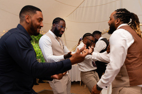 Groomsmen dancing together.