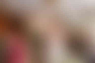 Bride fixing the grooms hair during the ceremony