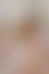 Daughter and her mum in wedding morning robes clinking glasses together