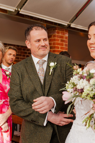 Father of the bride giving away his daughter