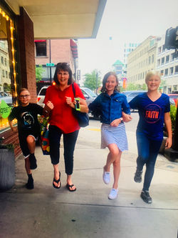 Keva, Rykelle, Grandma, and Eli skip around downtown Nampa.