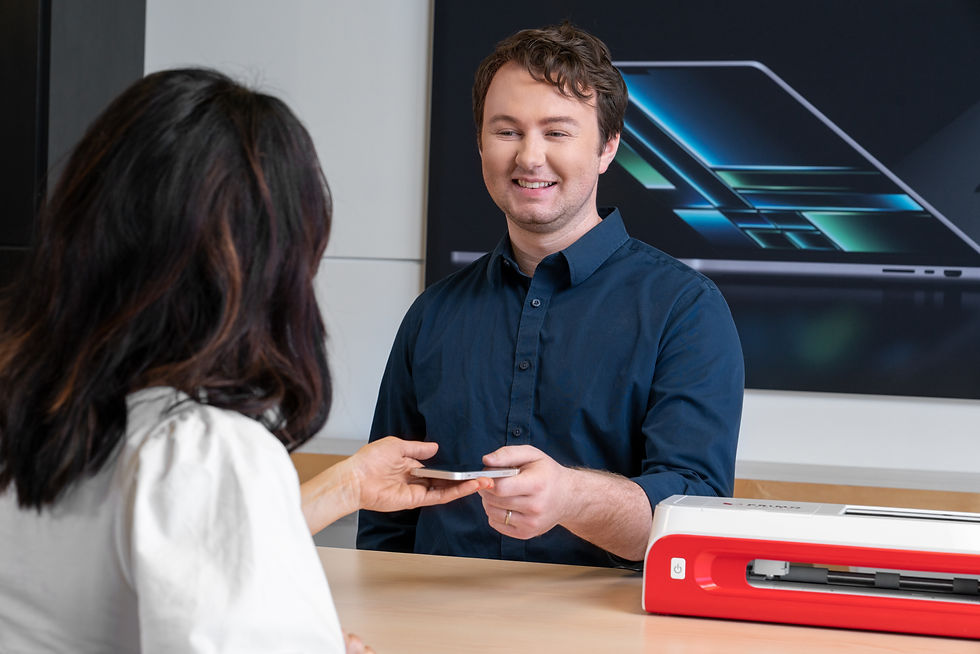 employee selling phone screen protector to customer