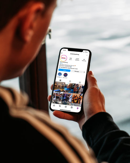 Man Holding iPhone Mockup