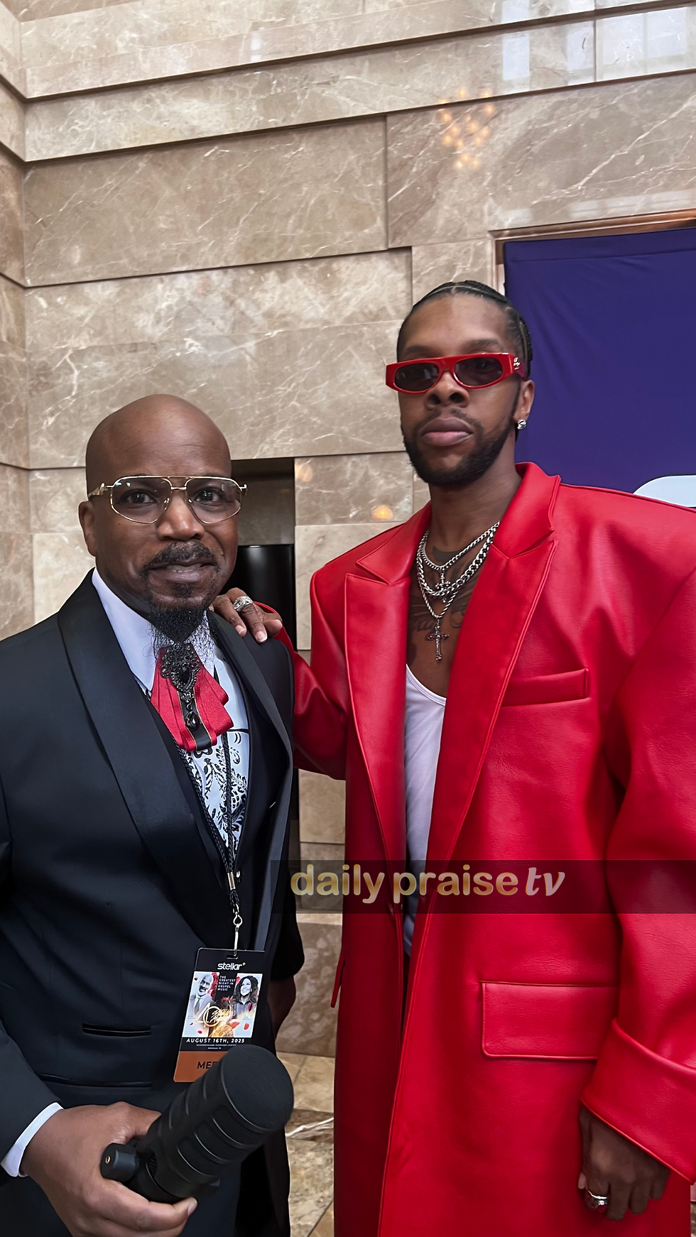 Jones shares a moment with soulful singer Aaron LeVelle on the red carpet, capturing a memorable highlight for DailyPraiseTV.