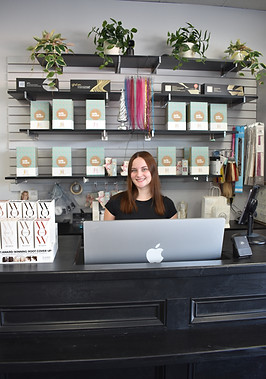 hazel the salon team member checking in a client at hazel the salon