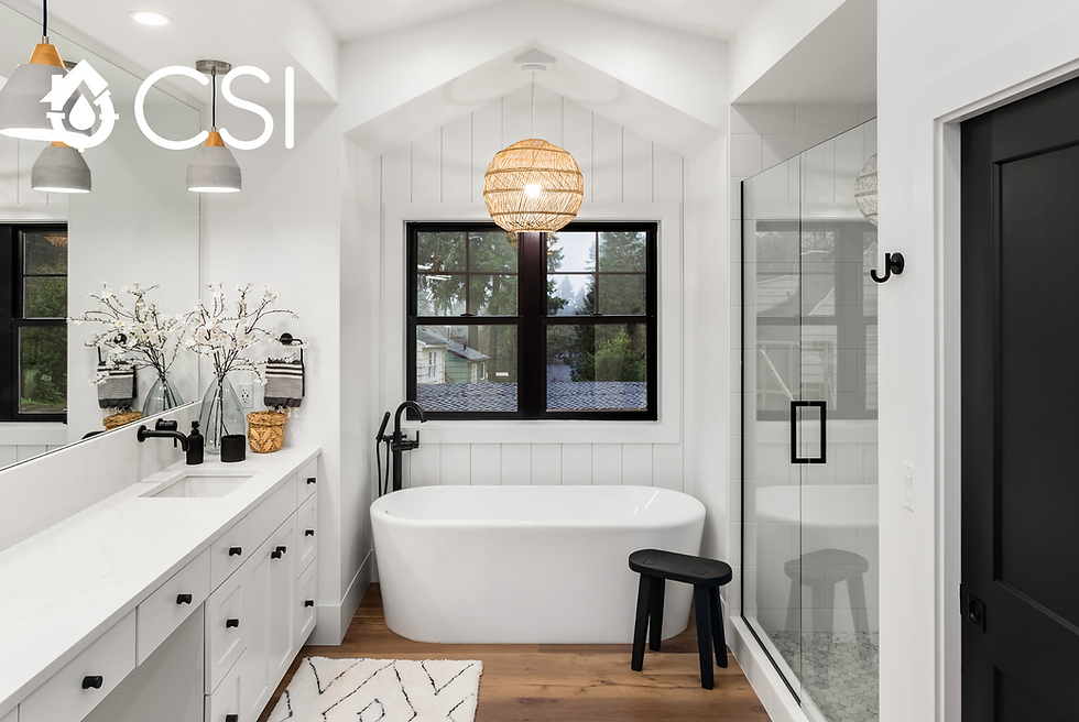 Bright bathroom showcasing a tub, sink, and shower, designed for comfort and convenience.