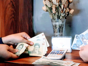 تحسن سعر التومان الإيراني