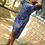 Thumbnail: Model Buy African Print Corset Dress styled with Tie up corset lace.