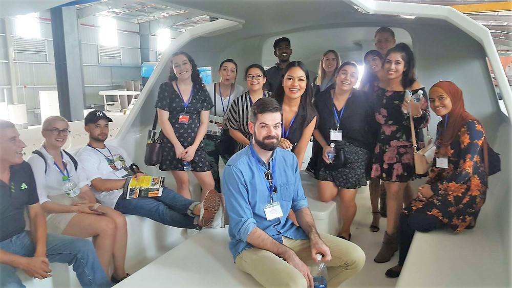 The International Business students from QUT find out for themselves just how big a 60' Rapido Trimaran is when visiting Triac Composites' factory in HCMC, Vietnam.