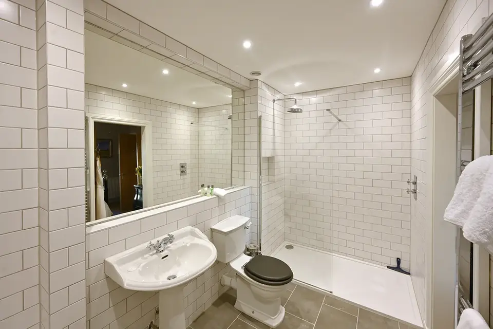 Milton House bathroom with walk in shower
