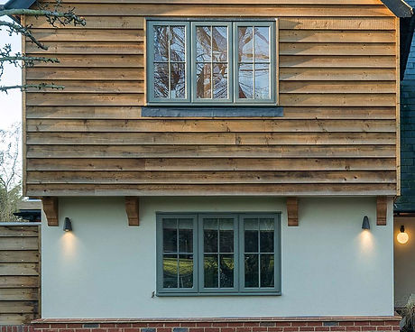Lipped casement windows, painted green