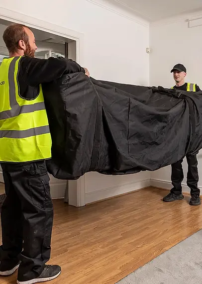 removal men lifting sofa