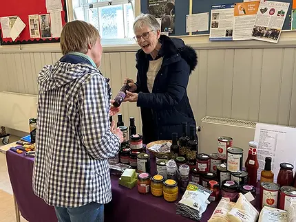 Trade Justice stall with customer