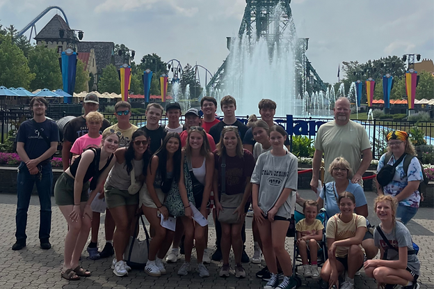 group of teens at an amusement park