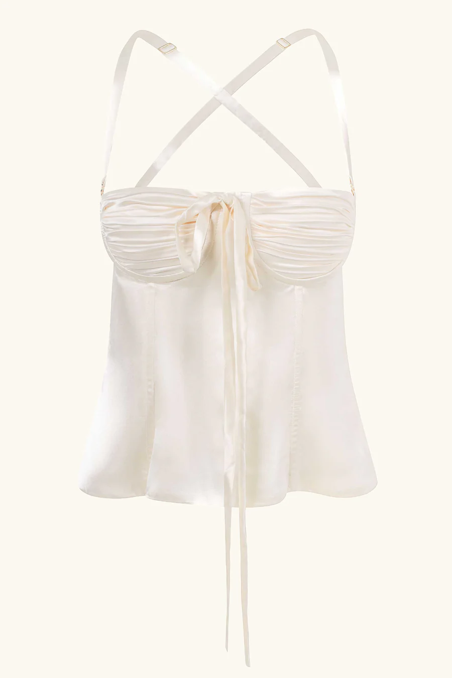 An underwired corset with detachable straps and a lace-up back. This bustier is cut for a slim, taut fit from silk satin and has carefully ruched cups that sit underneath a slightly curved, low neckline. Highlight the cut out back by sweeping your hair into a sleek claw clip. A closet staple, this piece will go with anything from light-wash denim to black tailored pants. Designed and produced in London with luxurious pure silk satin.