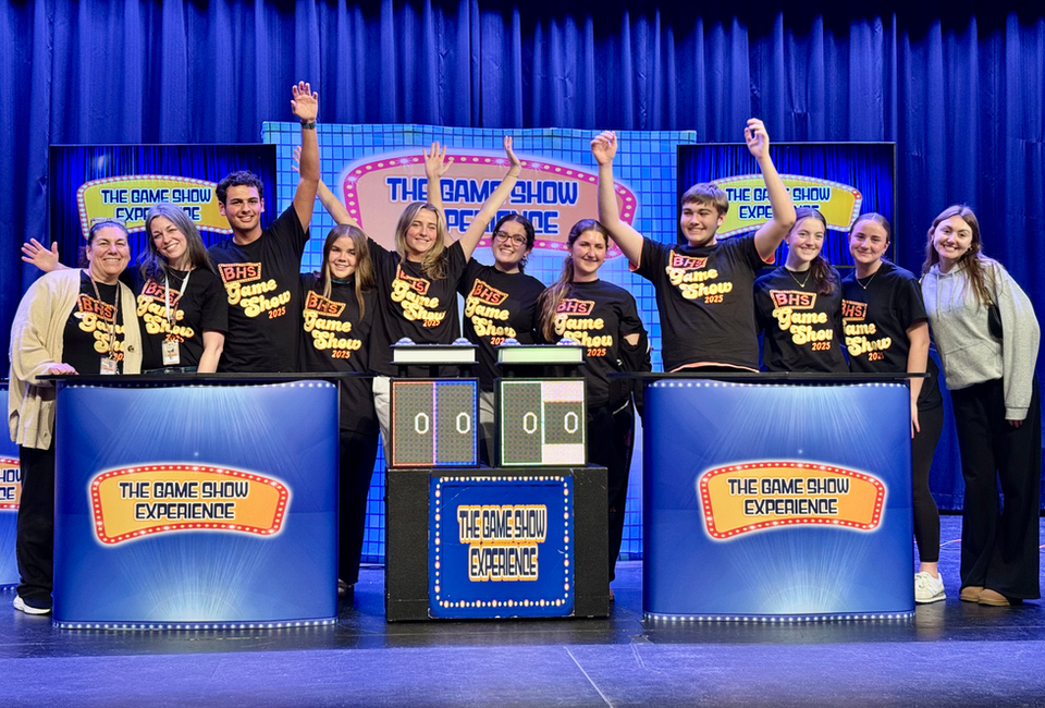 Photo of a group of people posing on the set of The Game Show Experience | The Game Show Experience | Game Show Event For Every Occasion