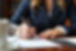 close-up-lawyer-signing-papers.jpg