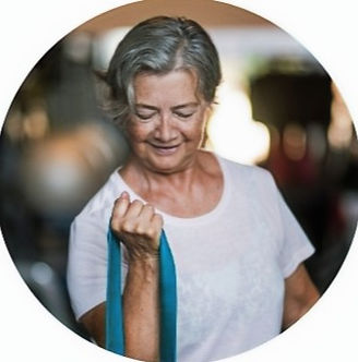 Older woman exercising with BFR bands