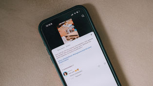 Smartphone displaying a social media feed