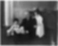 John Weeks reading a book to his grandchildren