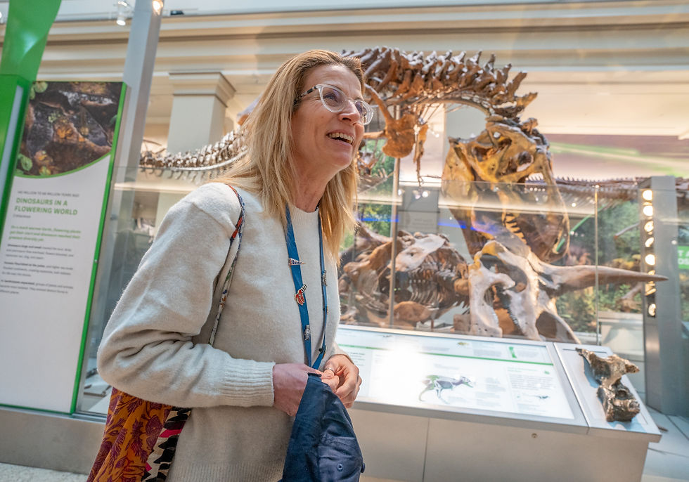 Unscripted guide, Meg, presents in front of the largest T-Rex found in the US at the Smithsonian Natural History Museum