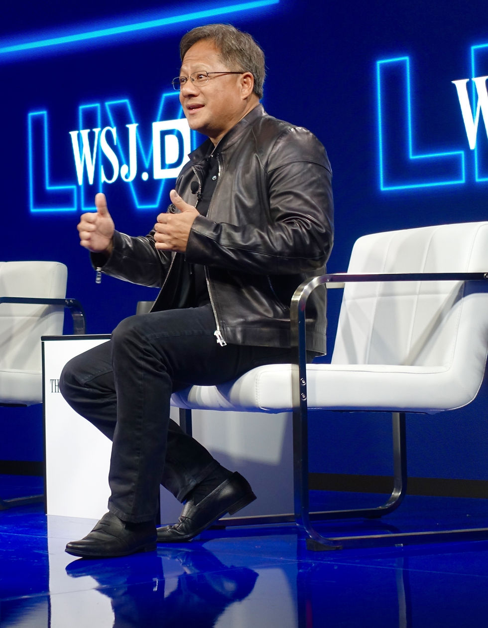 photo by "Jen-Hsun Huang, CEO of NVIDIA, carrying the torch for Moore’s Law"/ Jurvetson/ CC BY 2.0. Nvidia leader Jensen Huang discusses the company’s vision on stage. He shared Nvidia’s future plans in the interview.