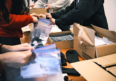 Photo of volunteers making kits