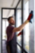 man-cleaning-window.png