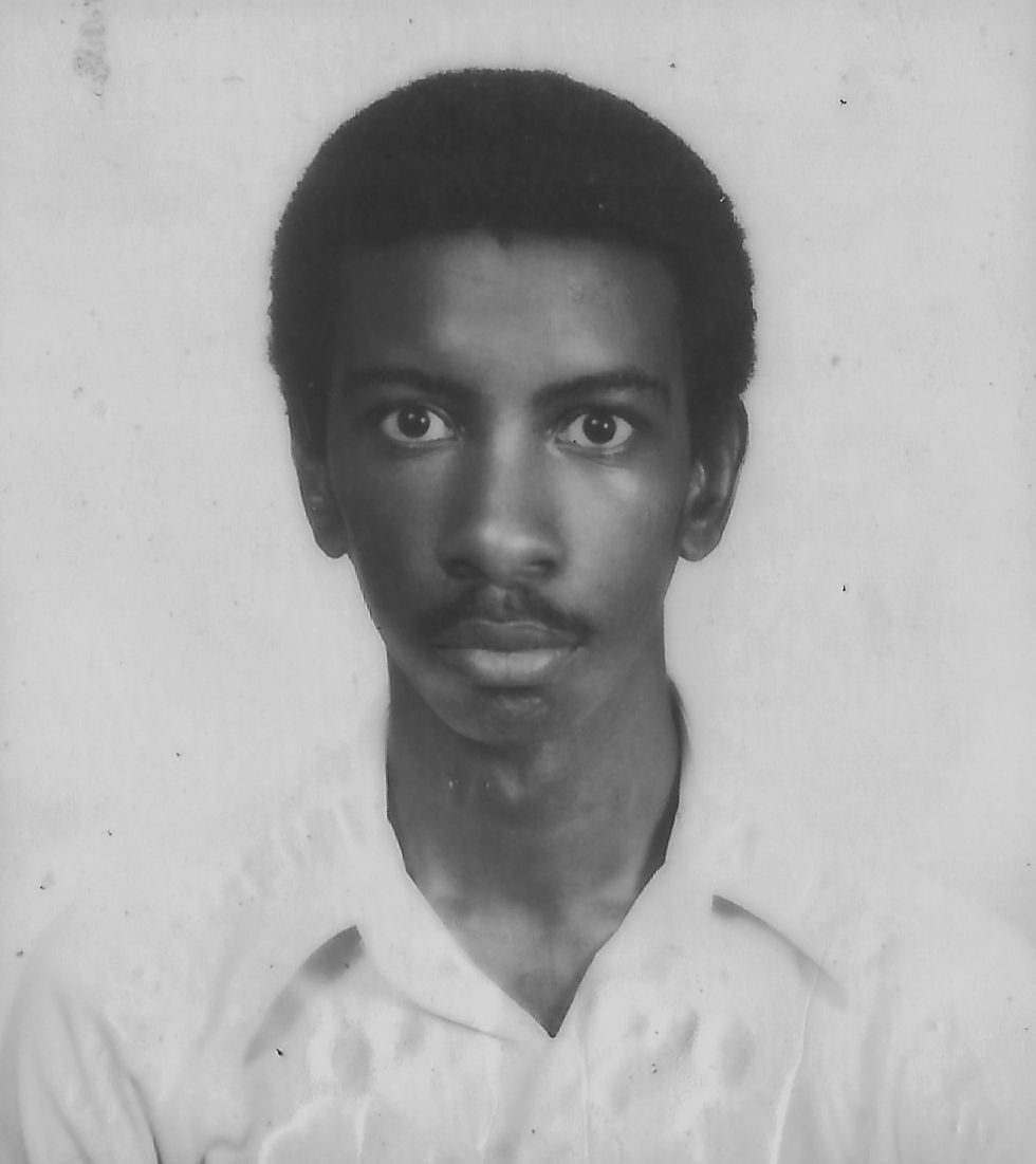 A young Grahame Facey in a monochrome portrait.