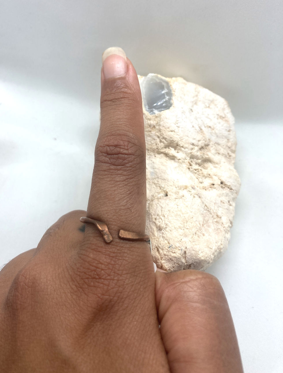 copper ring on pointer finger