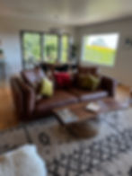 freshly cleaning living room and sofa after house cleaning services