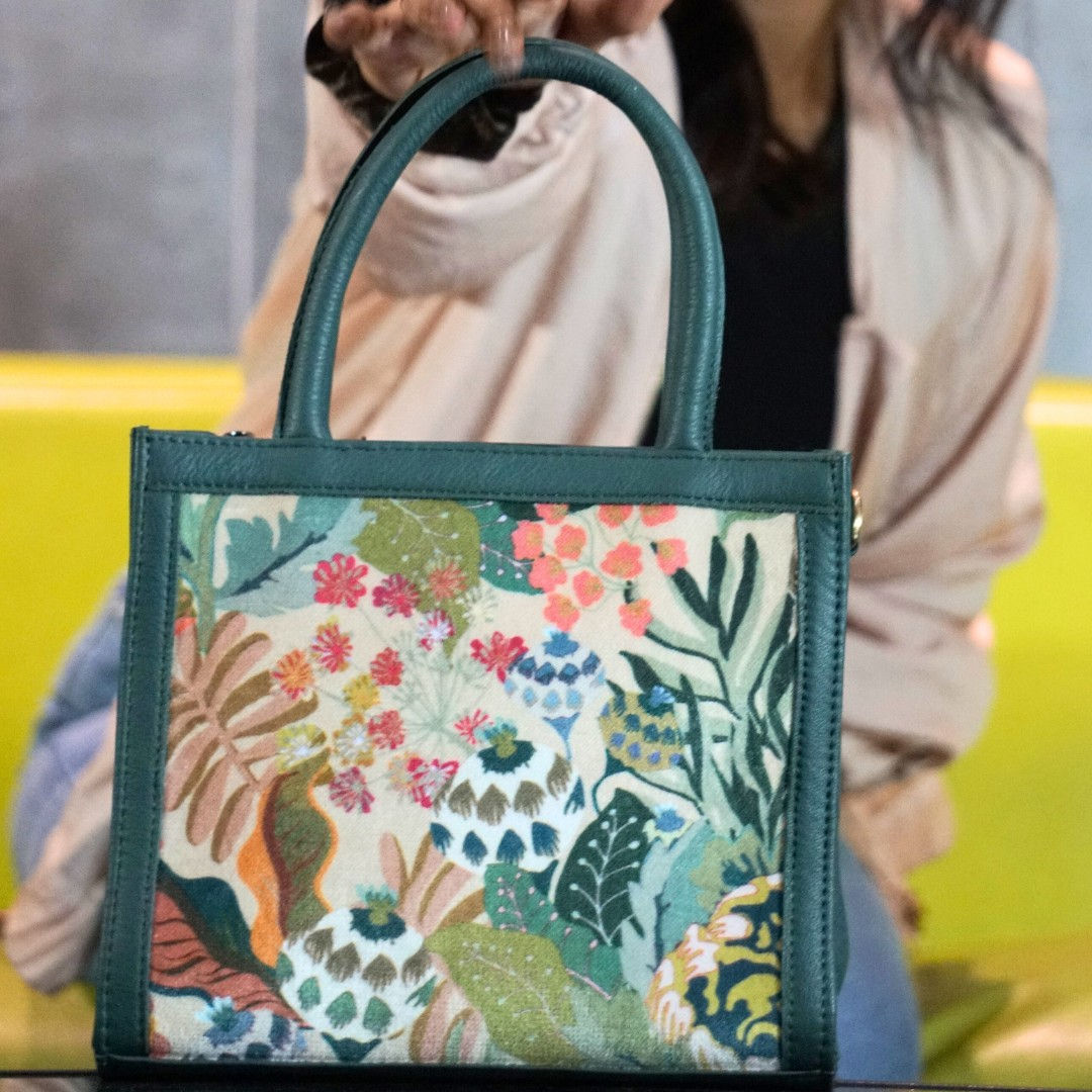 Green vegan leather sling bag with suede prints