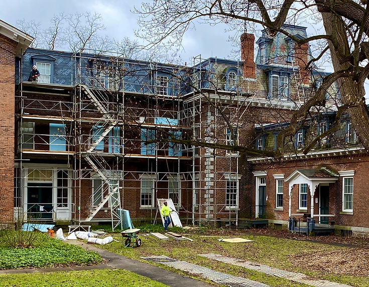 Contractors are working on the Oneida Community Mansion House preservation work on brick facade