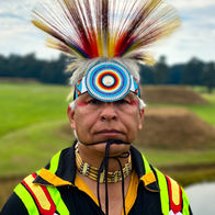 Native American Hoop Dancer, Lyndon Alec, poses for a portrait on the top of Mound P at Moundville Archaeological Park.  Shot on iPhone 11 Pro Max.